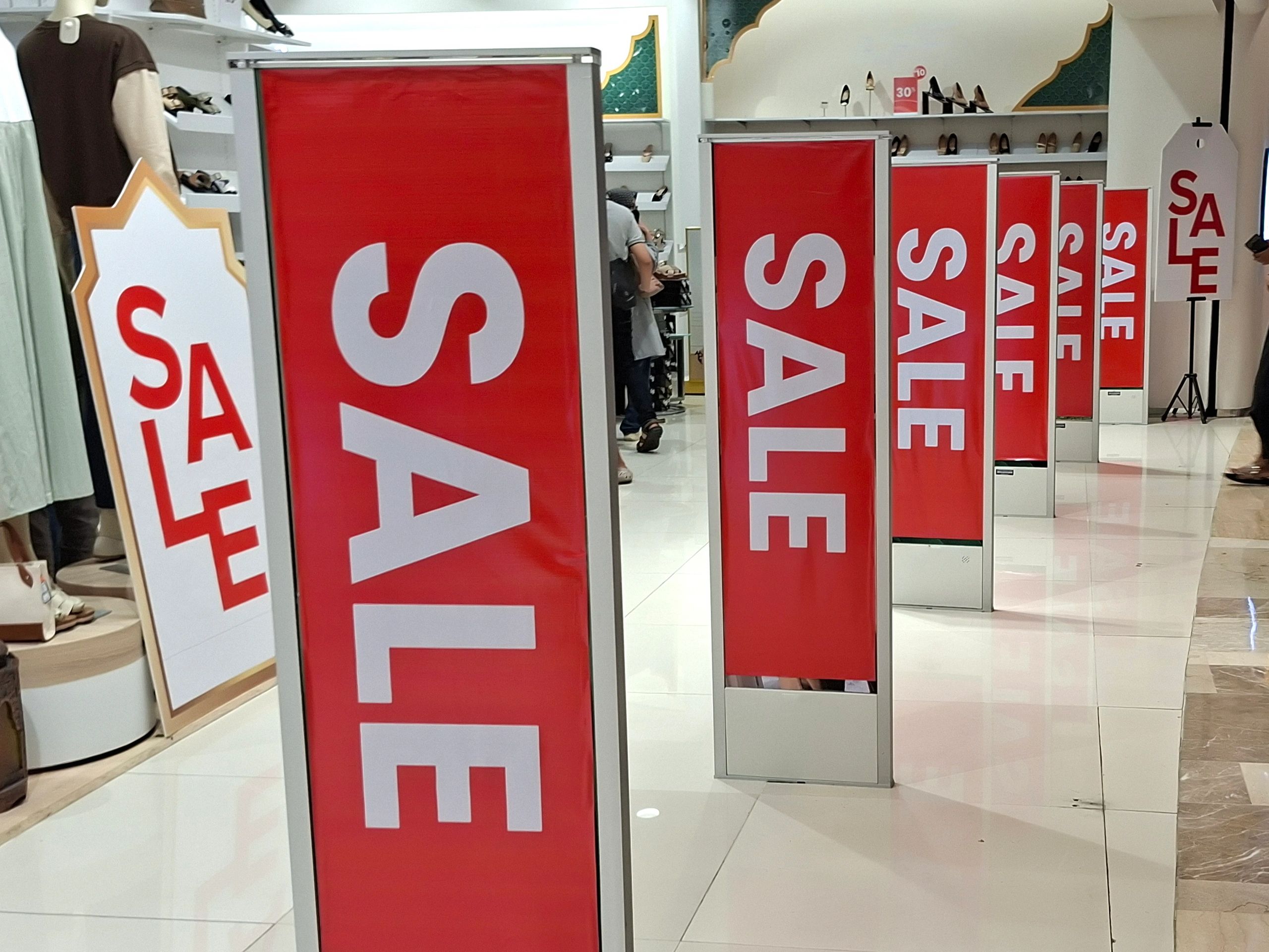 Storefront with bold window graphics and promotional decals